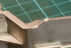 Rolling the edge of the running plate