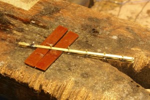 Using paxolin to space the bars.